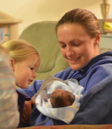 Ellery and Amber holding Alexandria