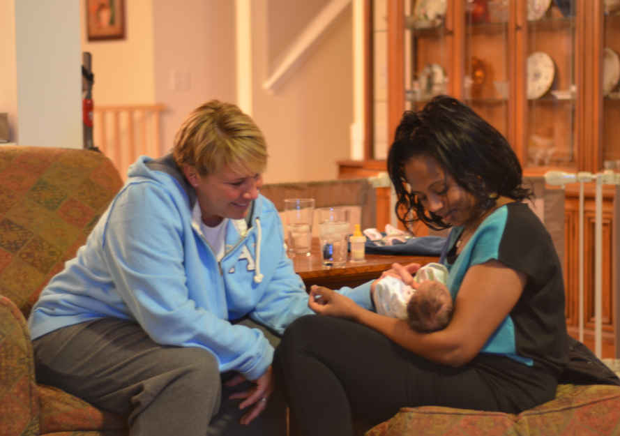 Joy and Senait holding Alexandria